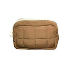 ranu tarde Gingerbread mini pouch in brown quilted parachute fabric with a durable nylon zipper closure.