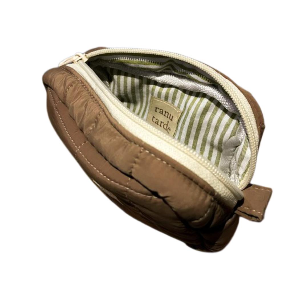 ranu tarde Gingerbread mini pouch in brown quilted parachute fabric with a green and white striped cotton lining.